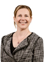 A headshot portrait of Judith Stewart on a plain white background