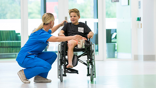 Nurse with boy in wheelchair at PCH